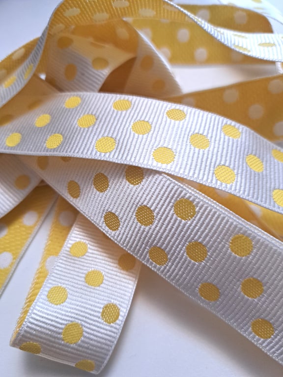 2.5 metres of yellow and white spotty ribbon, 25mm wide
