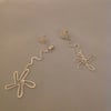 Silver flower stem earrings