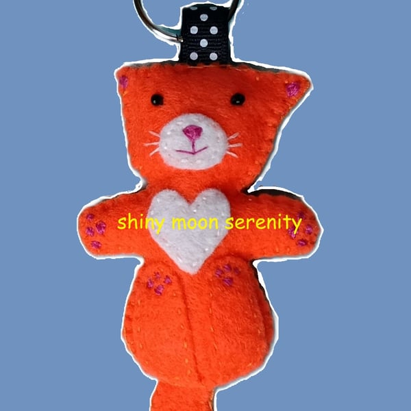 Cat on back Orange and White Felt Keyring.