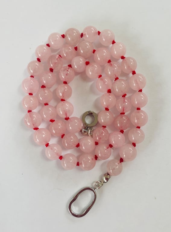 Rose quartz beaded necklace strung on red silk 