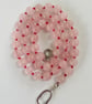 Rose quartz beaded necklace strung on red silk 