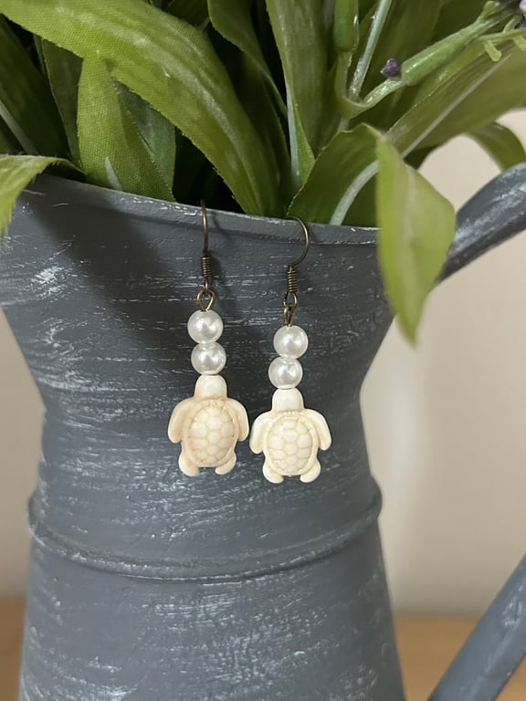 White turtle and pearl drop hook earrings