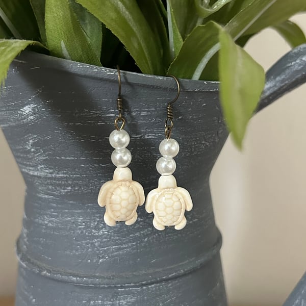 White turtle and pearl drop hook earrings