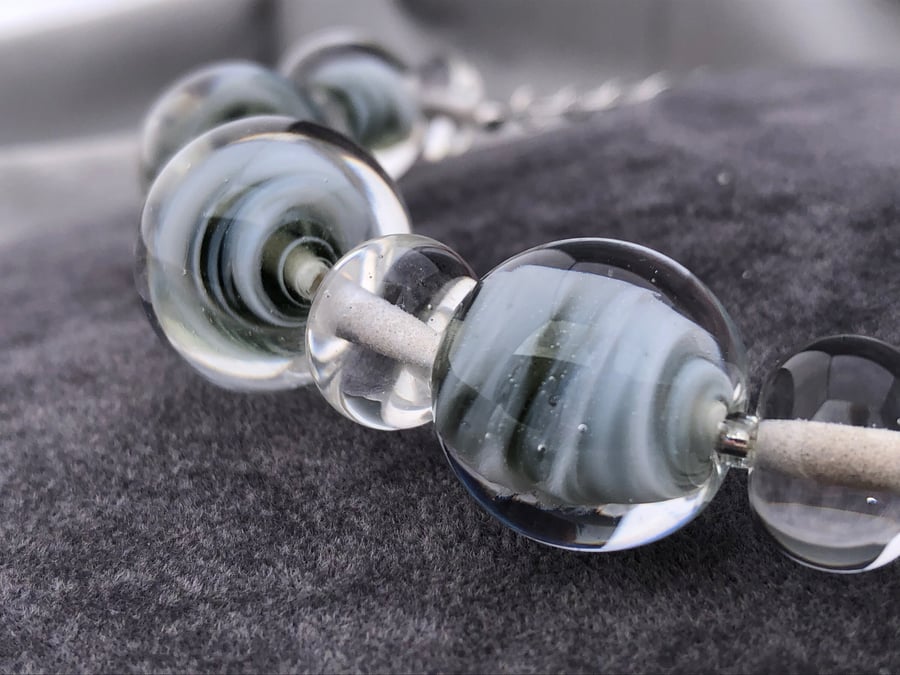 Pale grey and white swirled marble shaped lampwork glass beaded necklace