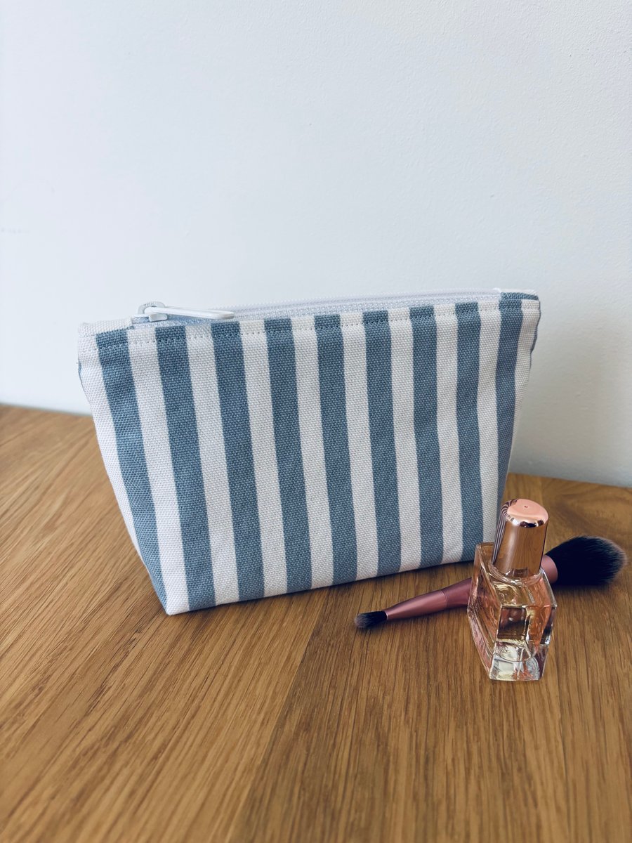 Small cotton makeup bag, pouch, purse, in blue and white stripes.