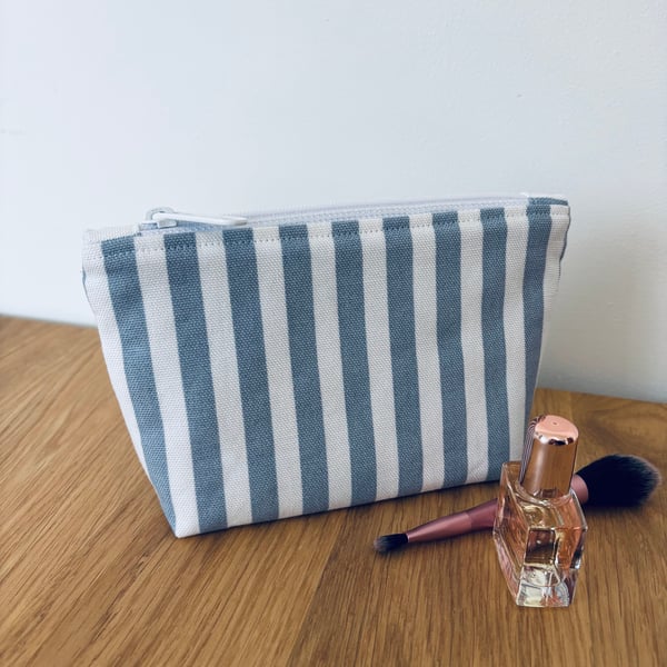 Small cotton makeup bag, pouch, purse, in blue and white stripes.