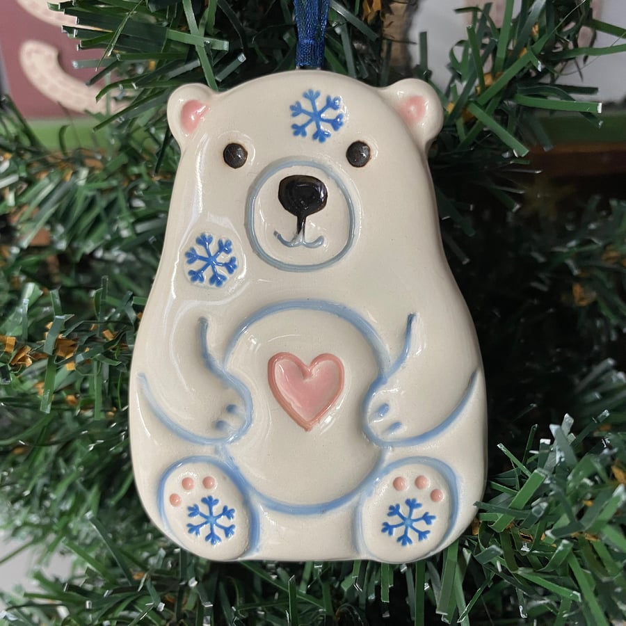 Ceramic polar bear with a pink heart