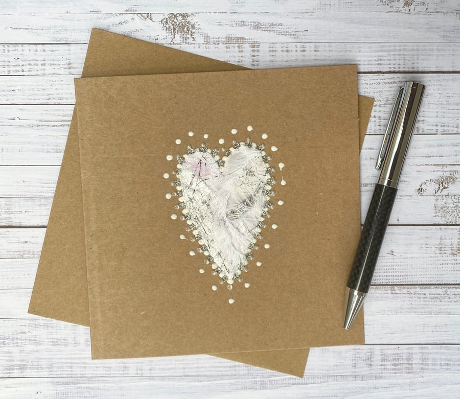 Up-cycled white and silver embroidered heart card. 