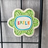 Large Smile pottery magnet green