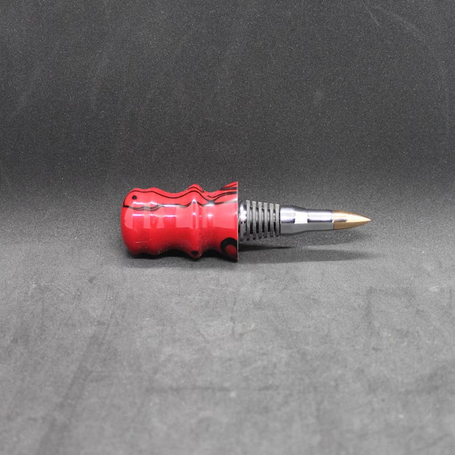 Handcrafted wine bottle stopper with a red and black acrylic top 