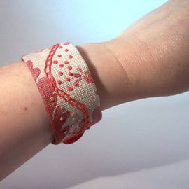 Printed linen cuff with hand embroidery in mixed colours