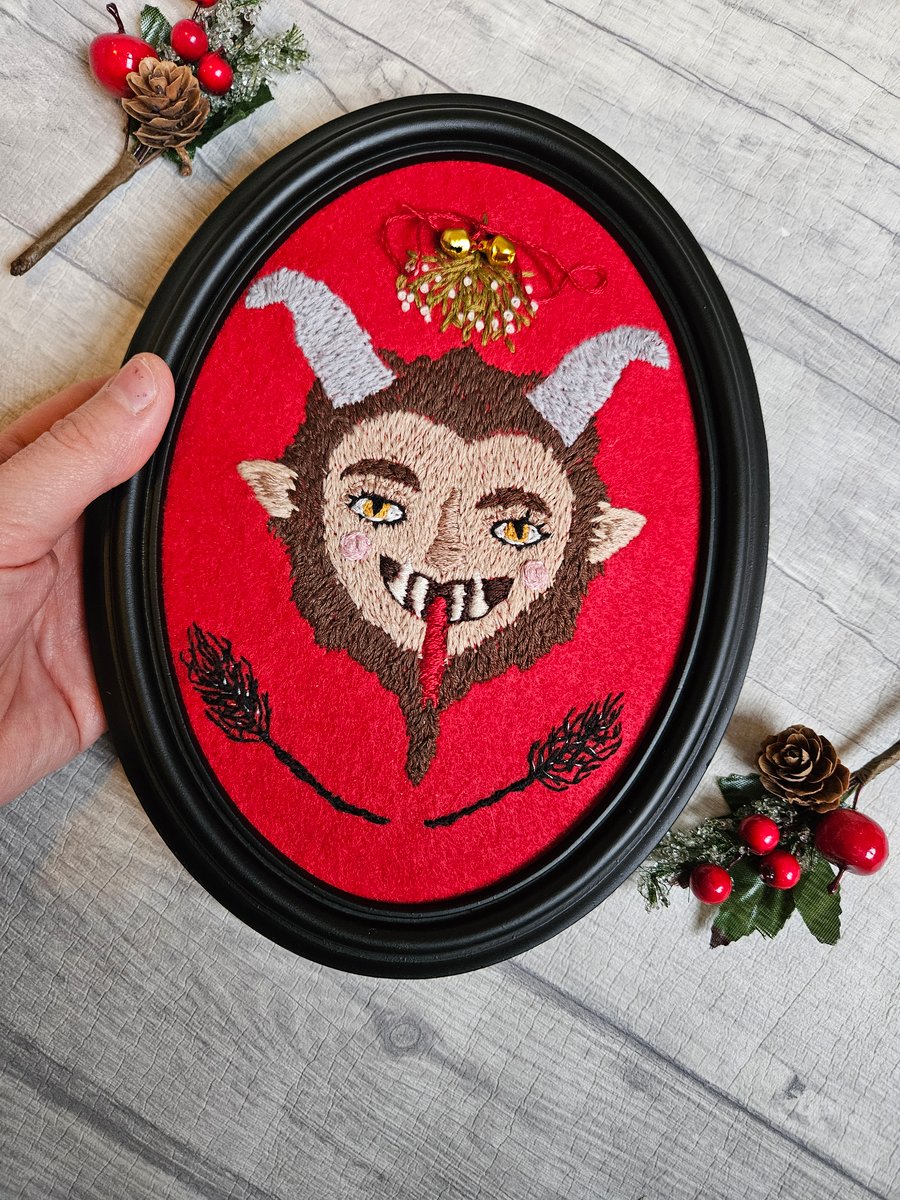 Krampus hand embroidery in black frame