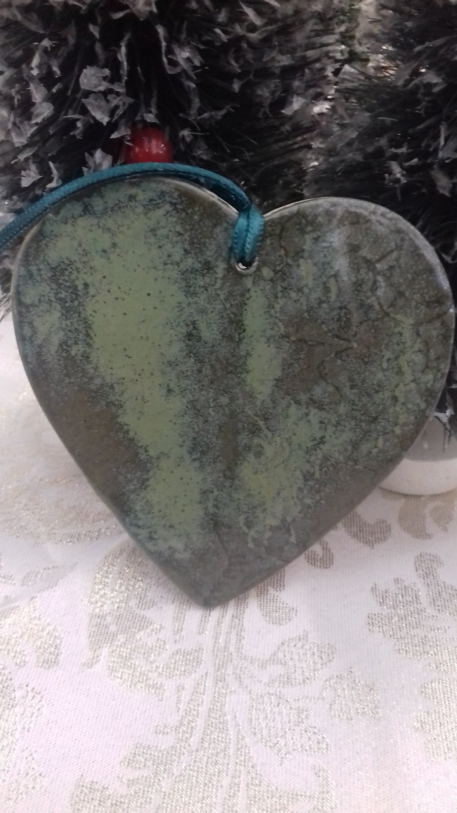 Handmade ceramic green heart hanging decoration