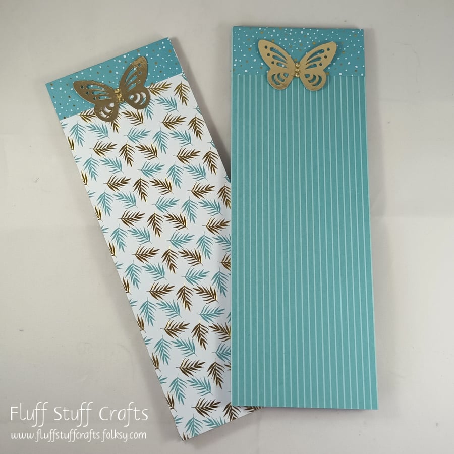 Pack of two lined notepads with teal and gold covers