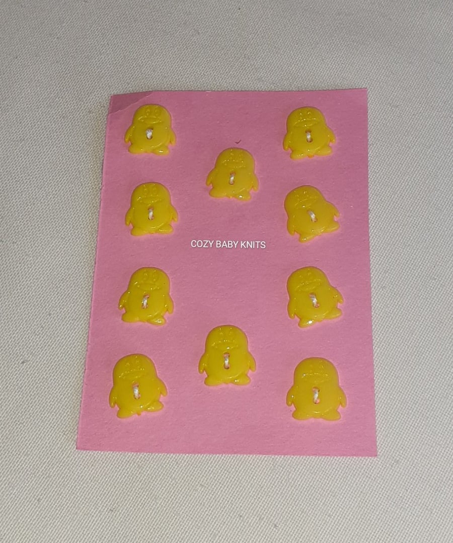 YELLOW PENGUIN SHAPED BUTTONS WITH TWO HOLES FOR ATTACHING 