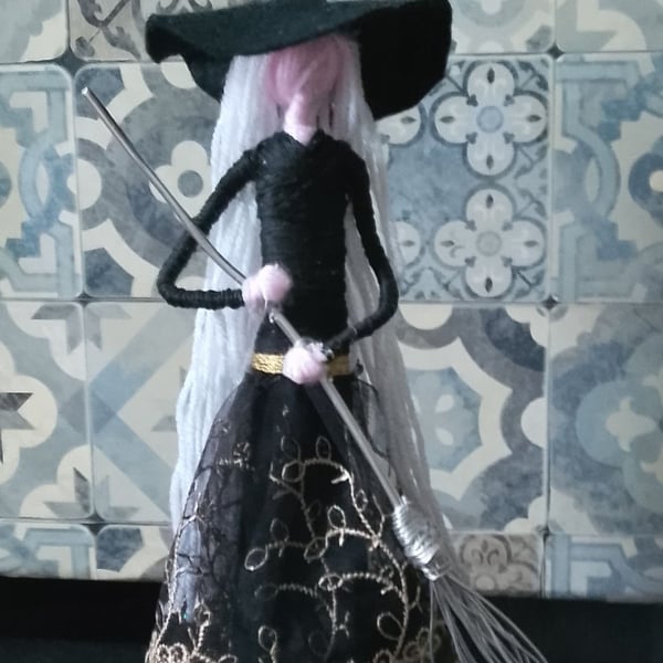 Witch figure  would look good on any shelf 