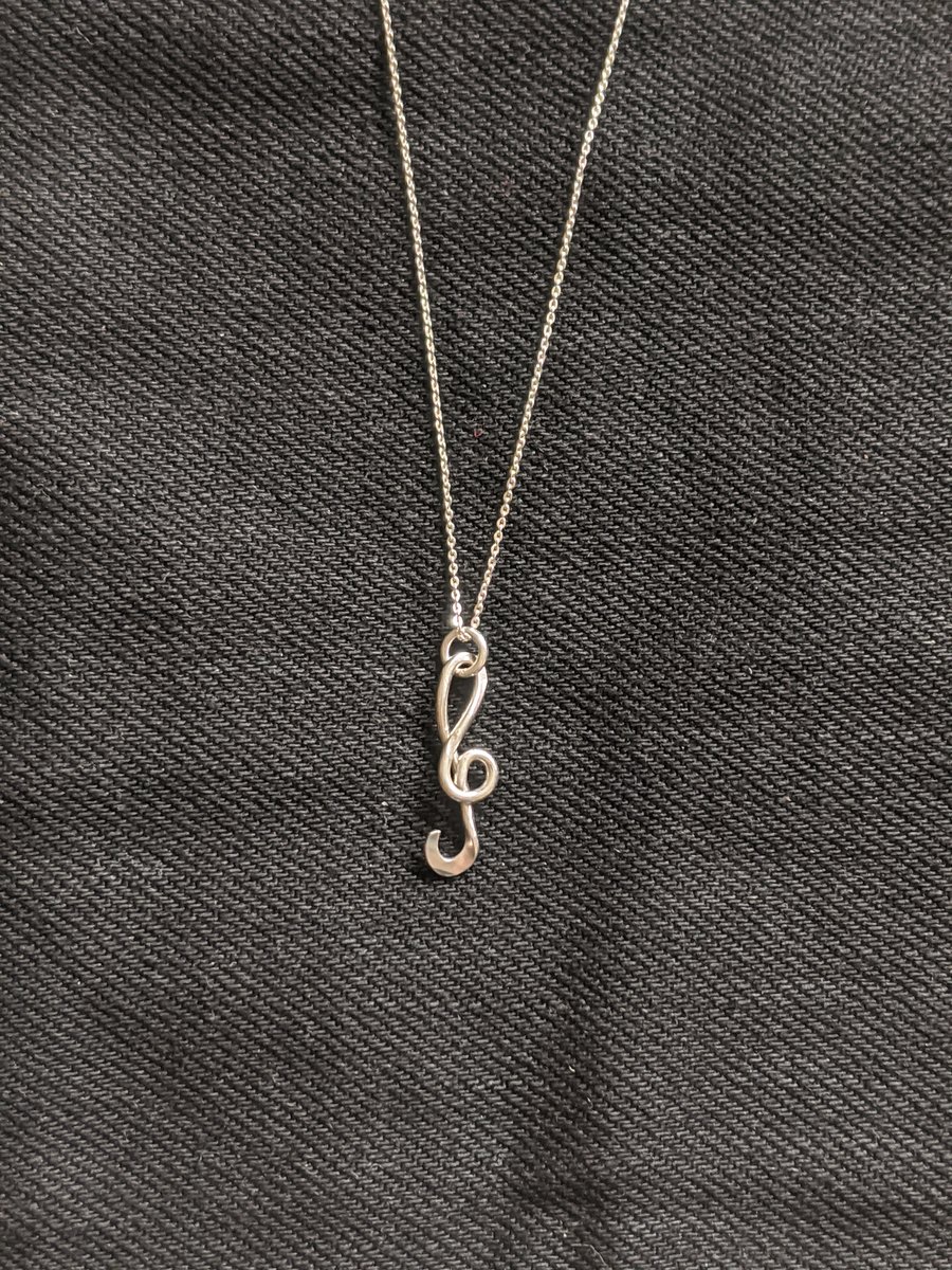 Solid silver handmade treble clef pendant on a silver chain