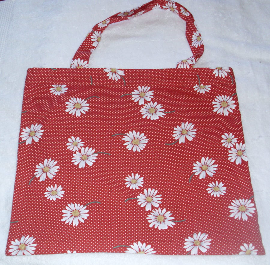 Bright white daisies on a red shopping bag , Tote bag