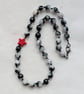 Black and white jade necklace with red howlite star - Image 1