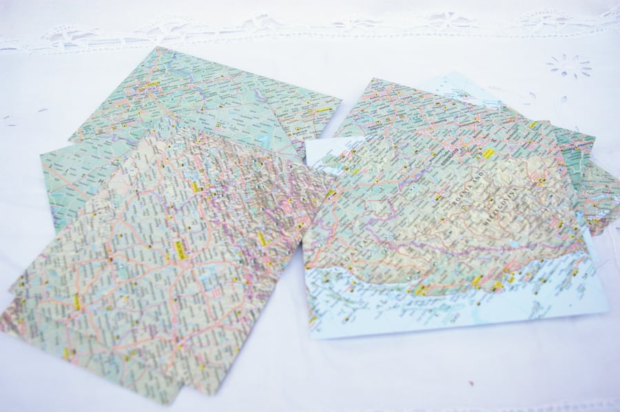 Ten handmade envelopes with from world maps