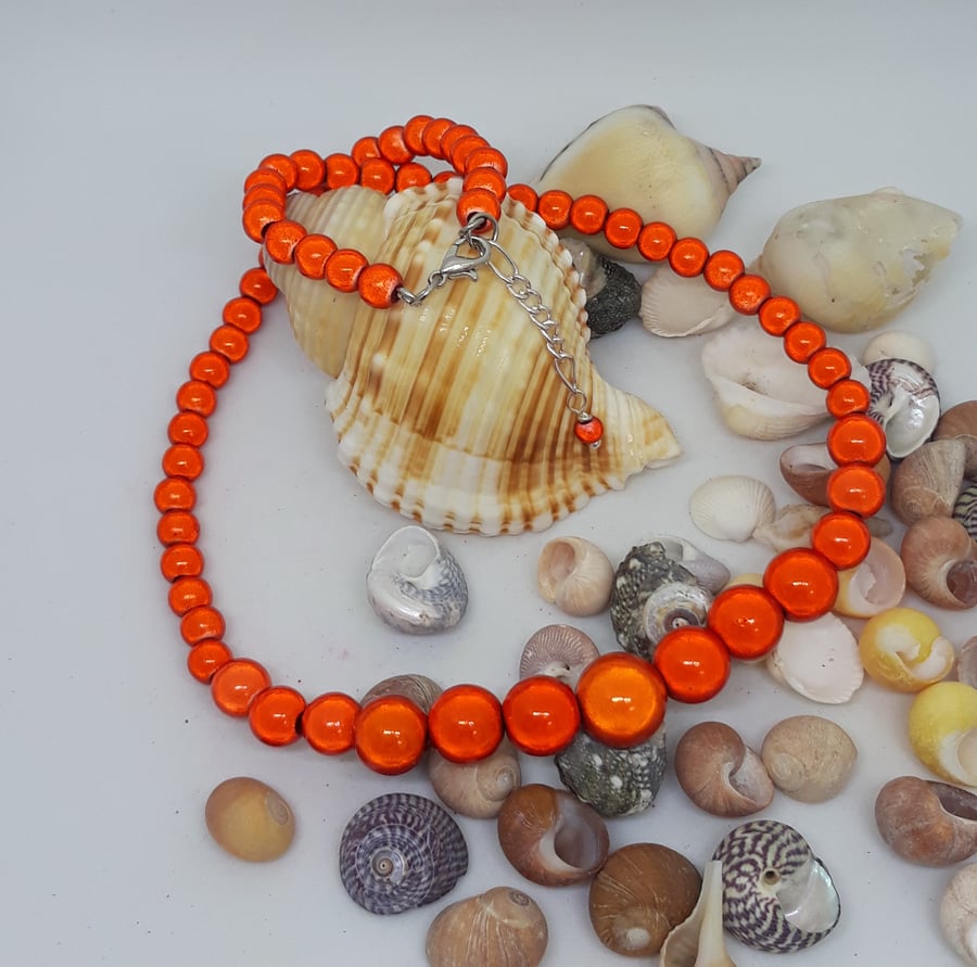 NL32 - Graduated orange miracle bead necklace