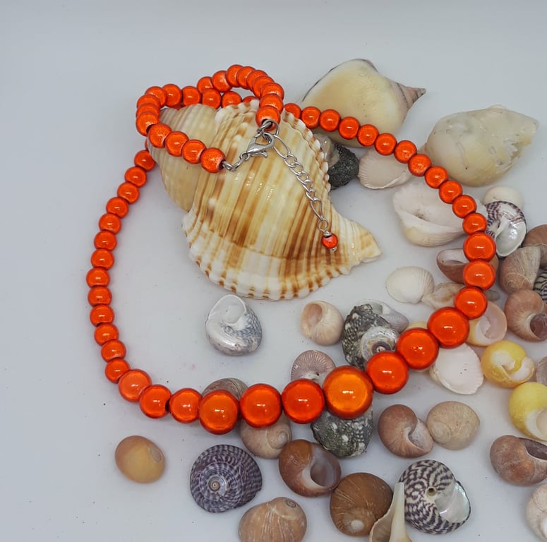 NL32 - Graduated orange miracle bead necklace