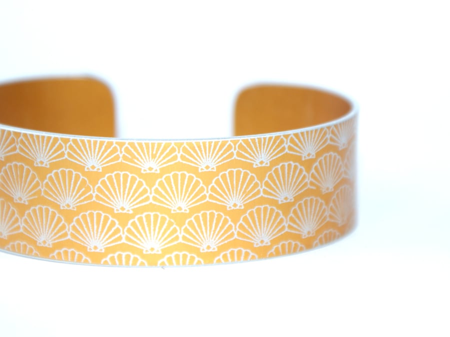 Geometric shell pattern cuff bracelet orangey yellow