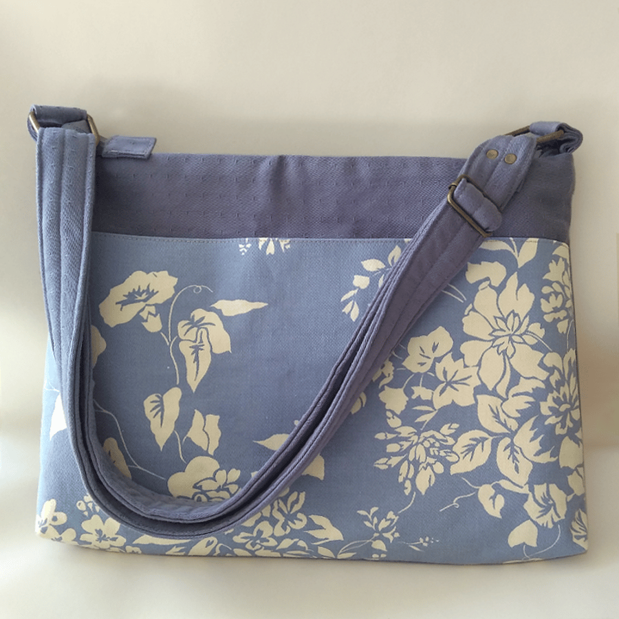 Blue and cream crossbody laptop bag with adjustable strap