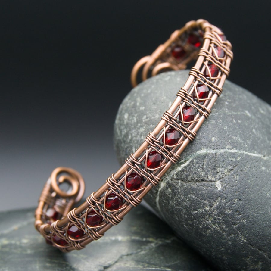 Copper wire armcuff with glass beads, An intricately handwo…