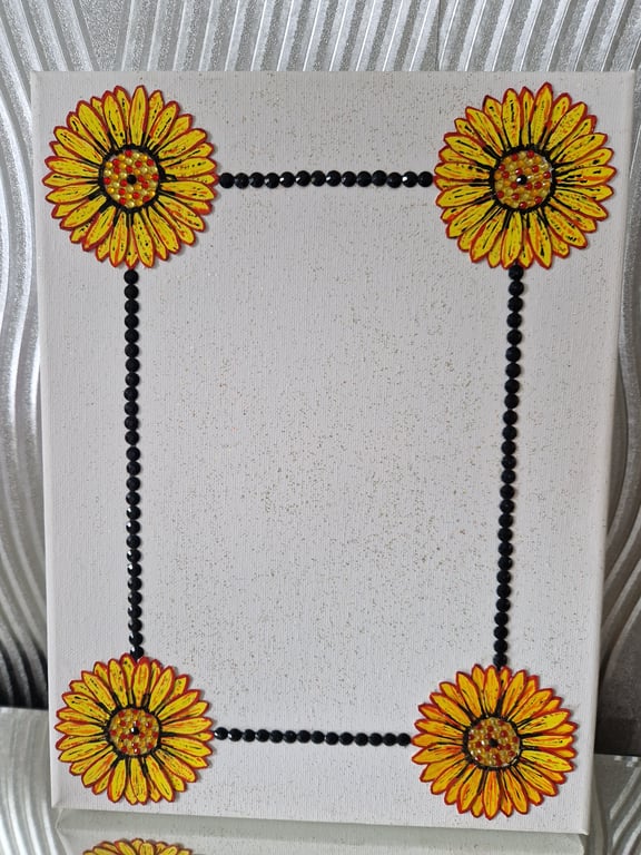 Canvas photo frame featuring a flower border. 
