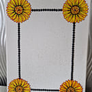 Canvas photo frame featuring a flower border. 