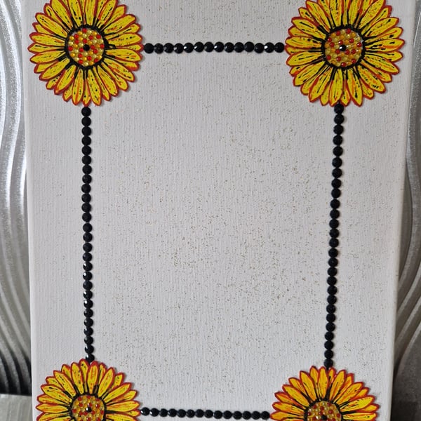 Canvas photo frame featuring a flower border. 