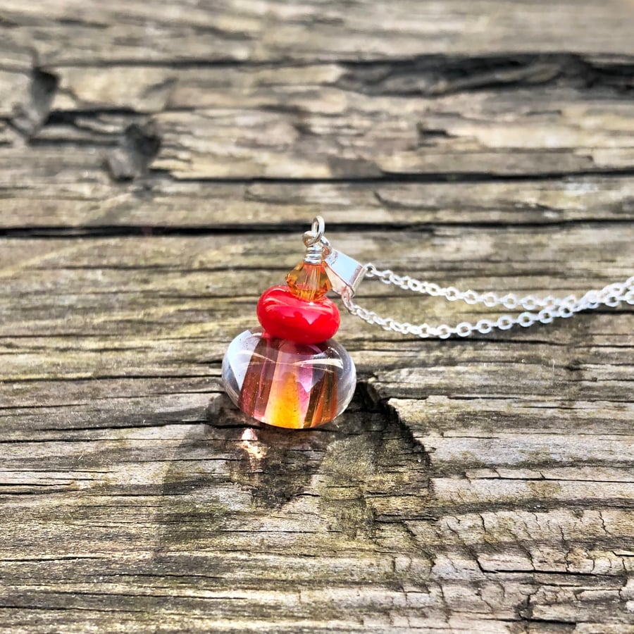Red & orange lampwork glass pendant on sterling silver chain