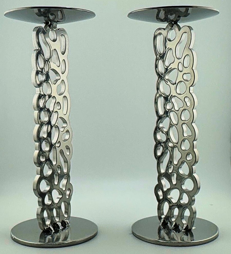 Luxury modern and contemporary chrome pair of candle holders
