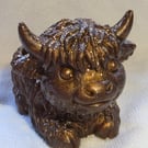 Baby highland cow candle holder . Gold glitter and dark brown 
