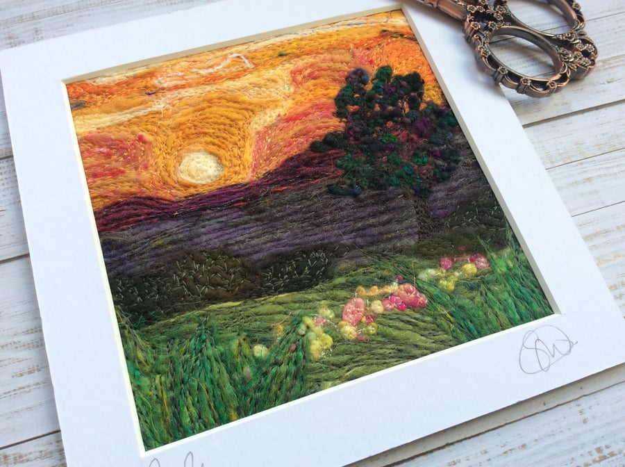 Embroidered sunset needle felted countryside landscape. 