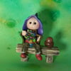 Tiny seated Gnome 'Hamish' with wired legs on bench seat OOAK by Ann Galvin