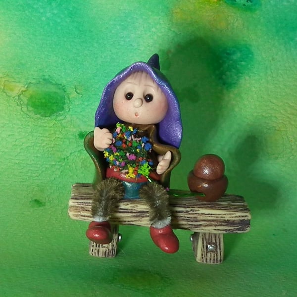 Tiny seated Gnome 'Hamish' with wired legs on bench seat OOAK by Ann Galvin