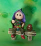 Tiny seated Gnome 'Hamish' with wired legs on bench seat OOAK by Ann Galvin