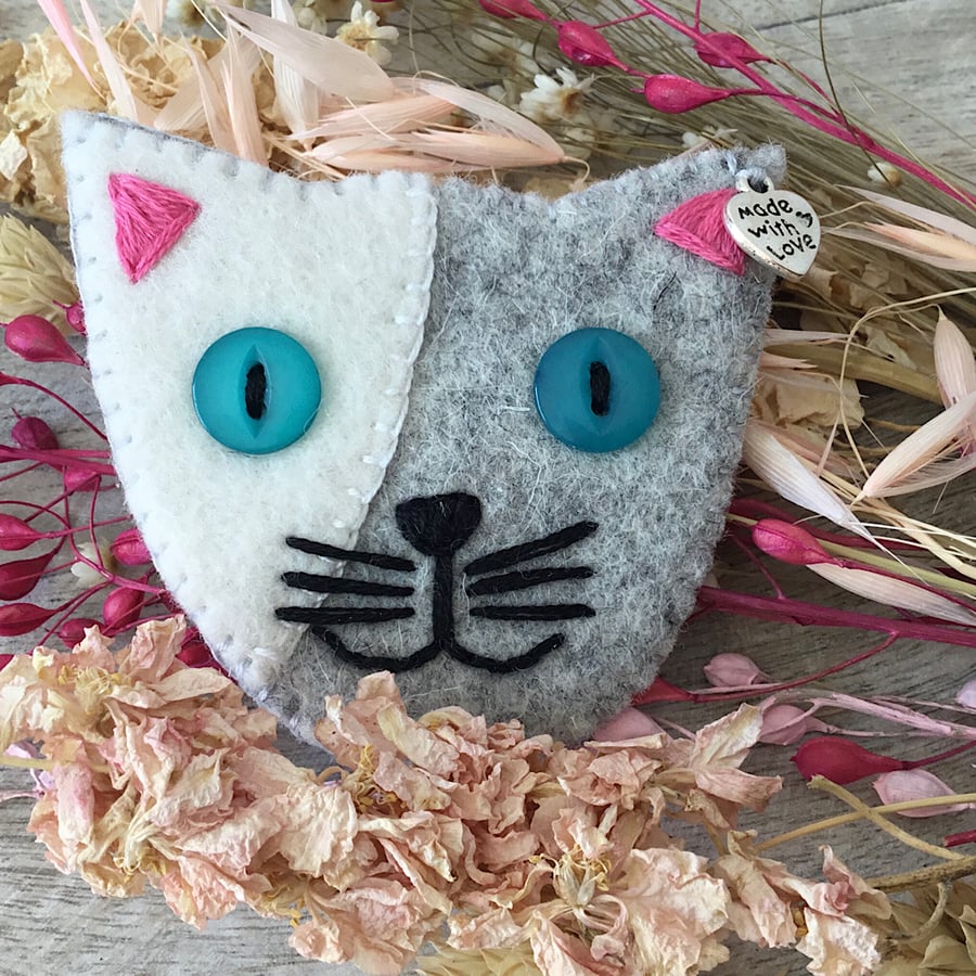 Mischievous Cat Brooch with Blue Eyes