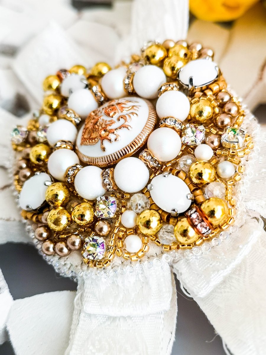 Gloria Swarovski crystal embellished beaded white and gold order ribbon brooch