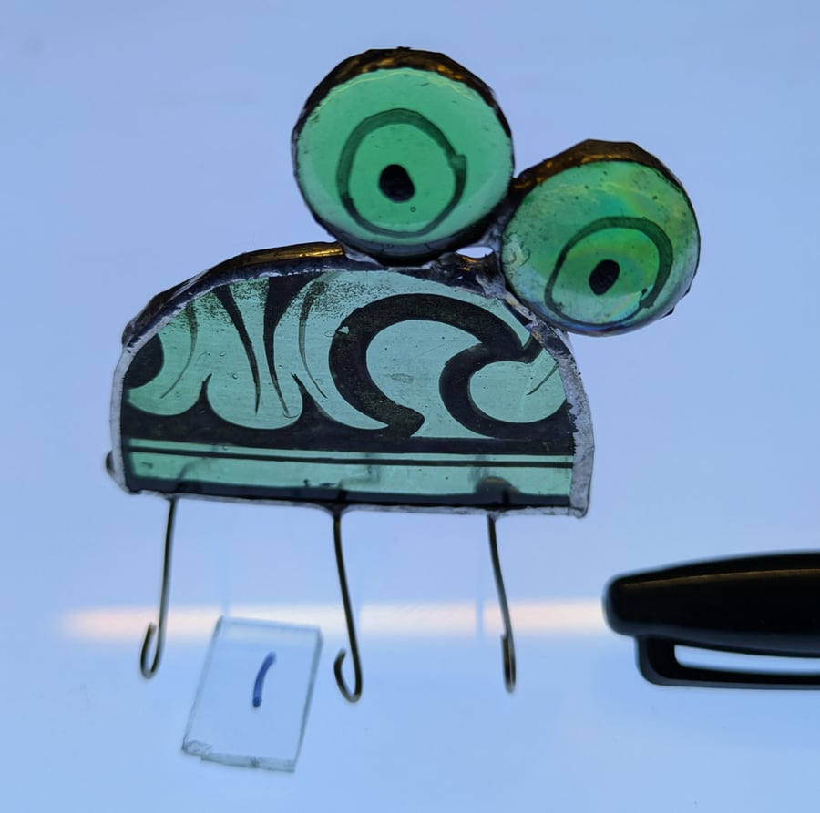 Infestive painted stained glass dome shaped  Bugs with painted eyes and bodies