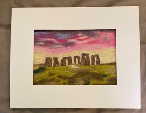 Felted picture of Stonehenge at dawn.