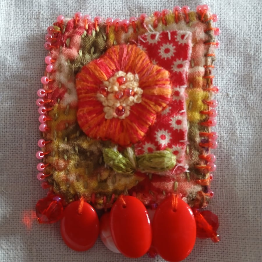 Orangle floral, Slow-stitched and beaded brooch.