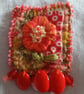 Orangle floral, Slow-stitched and beaded brooch.