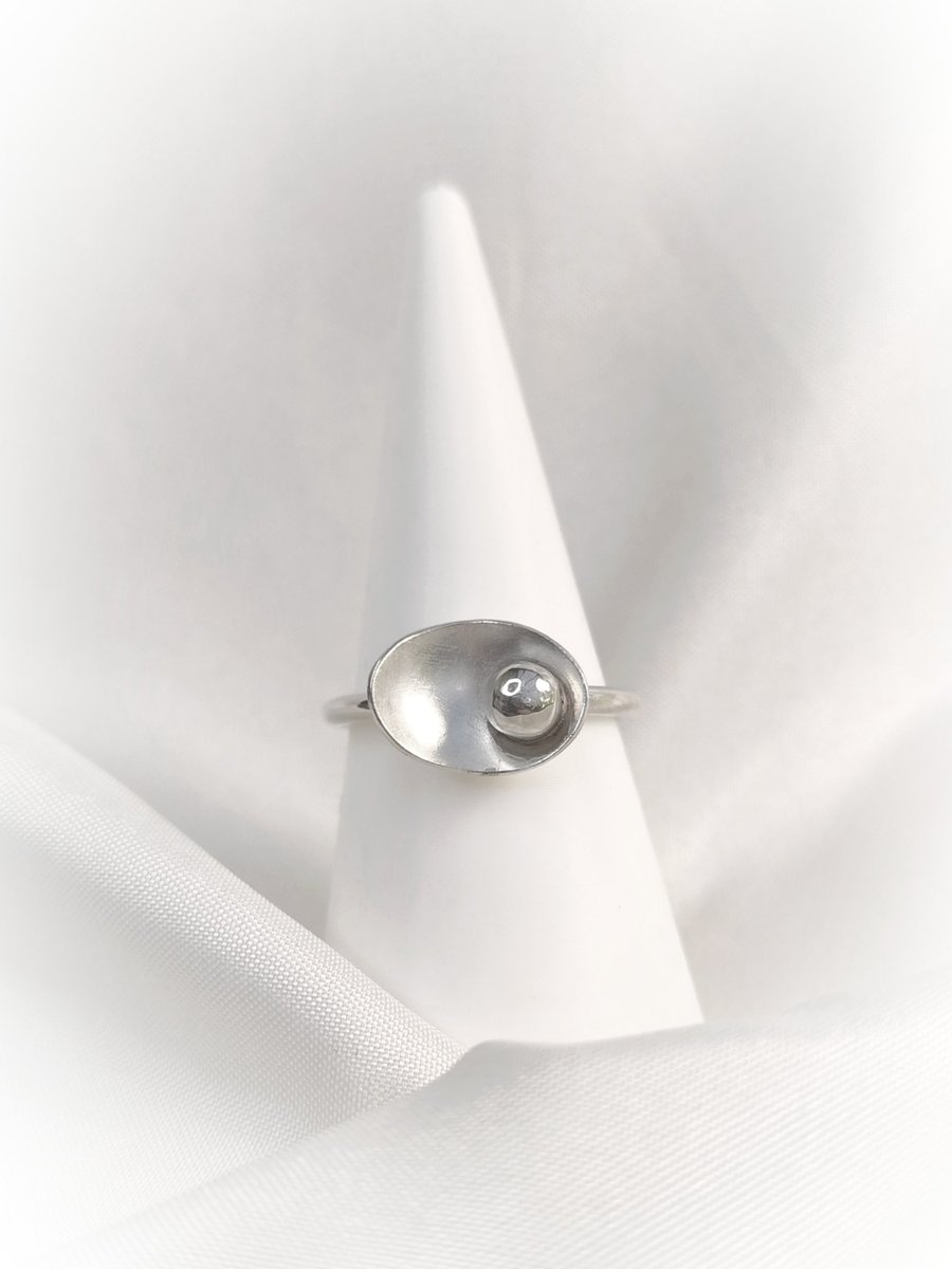 Sterling silver ring with pebble in the petal