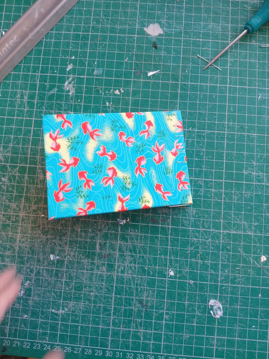 A7 sketchbook coptic stitch and japanese fish cover