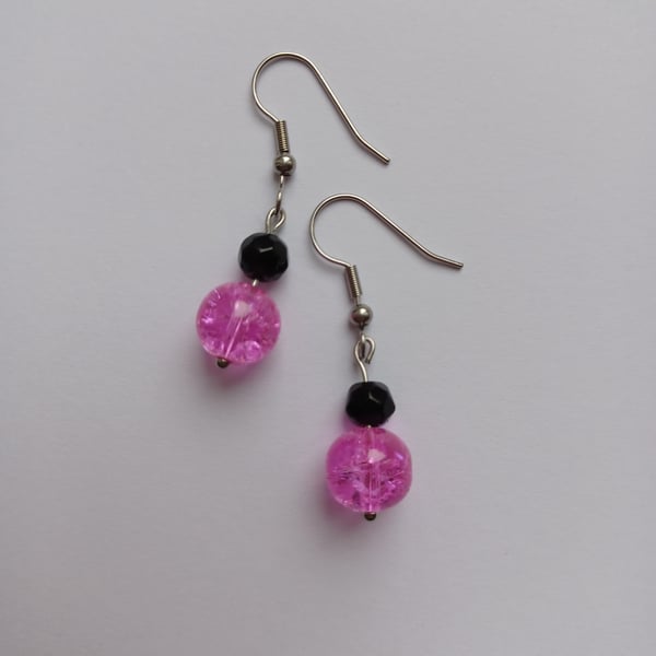 Bright pink crystal bead & black bead drop earrings