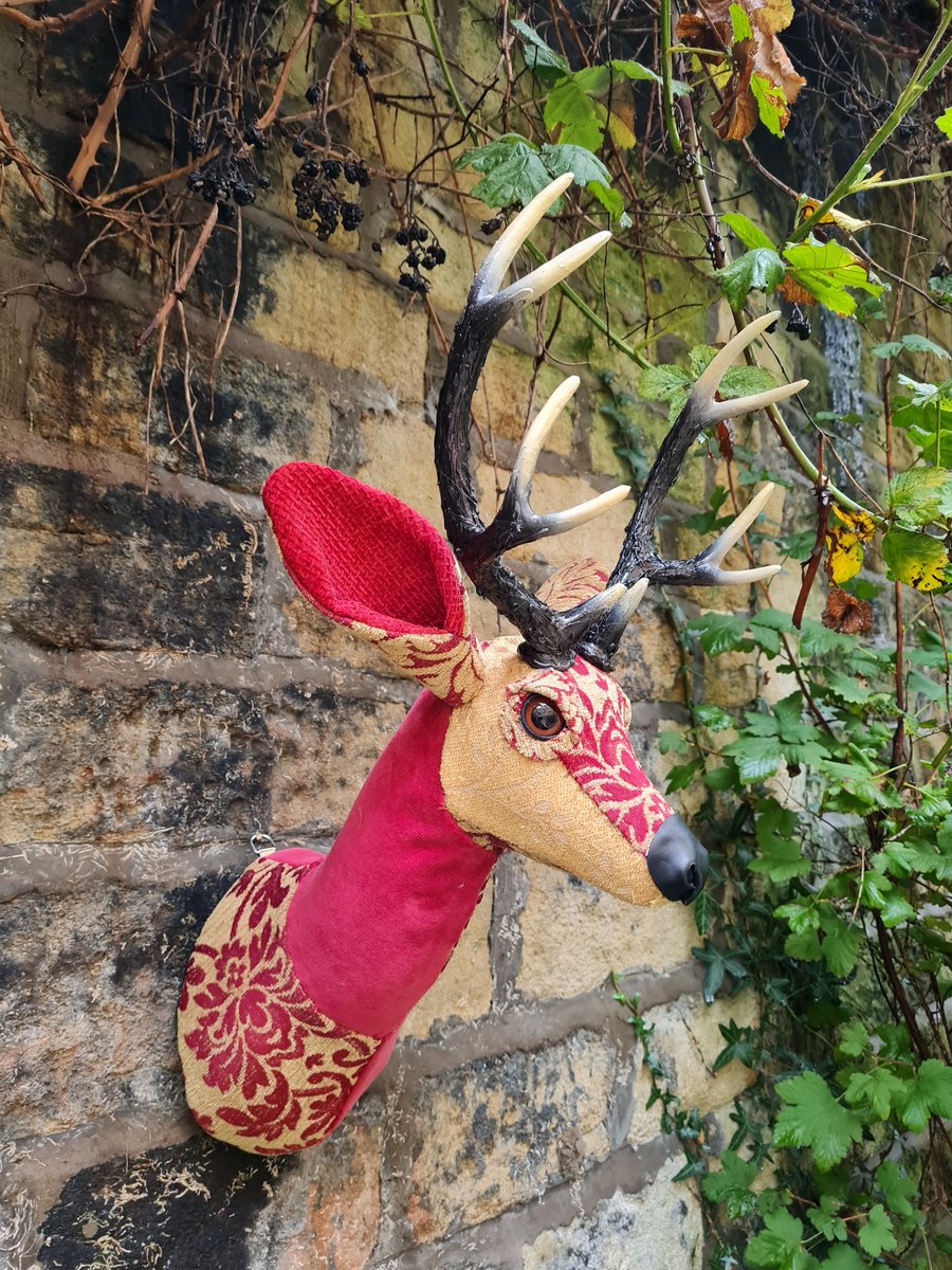 Faux deer head in rich red and gold brocade fabric