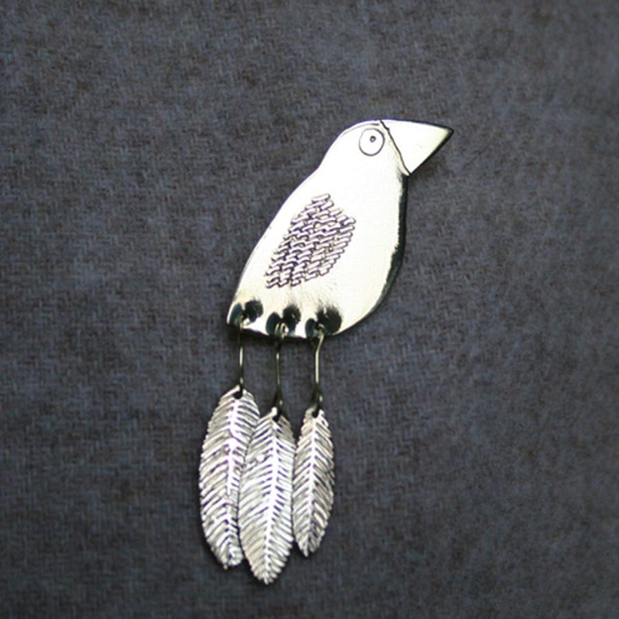 Dangly tail bird brooch